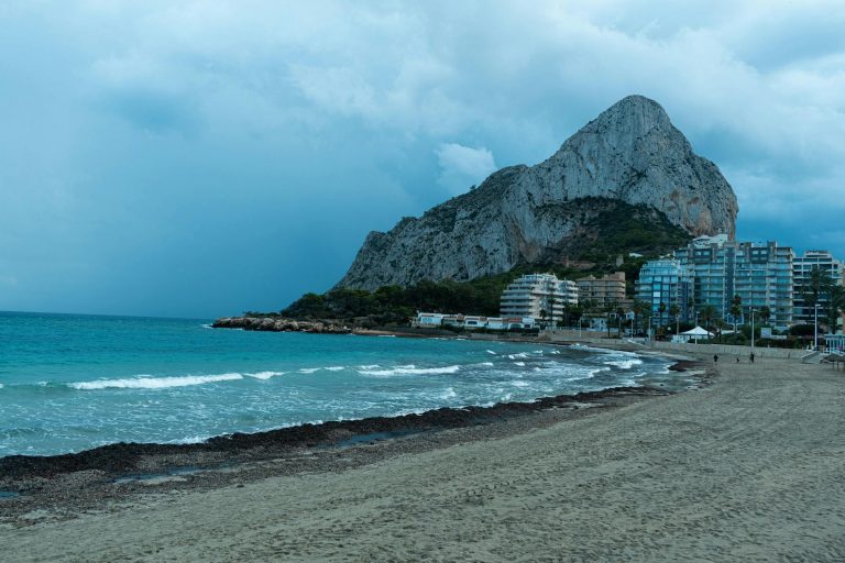 photo of a beach with a view of a mountain